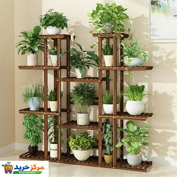 استند گلدان چوبی مدل Mtf5 با ابعاد 120x110x25 سانتی‌متر، ساختار چندطبقه مقاوم از چوب روس مناسب برای چیدمان و نگهداری انواع گلدان‌ها در فضای داخلی و خارجی